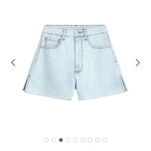 WeWoreWhat light wash flair denim shorts.